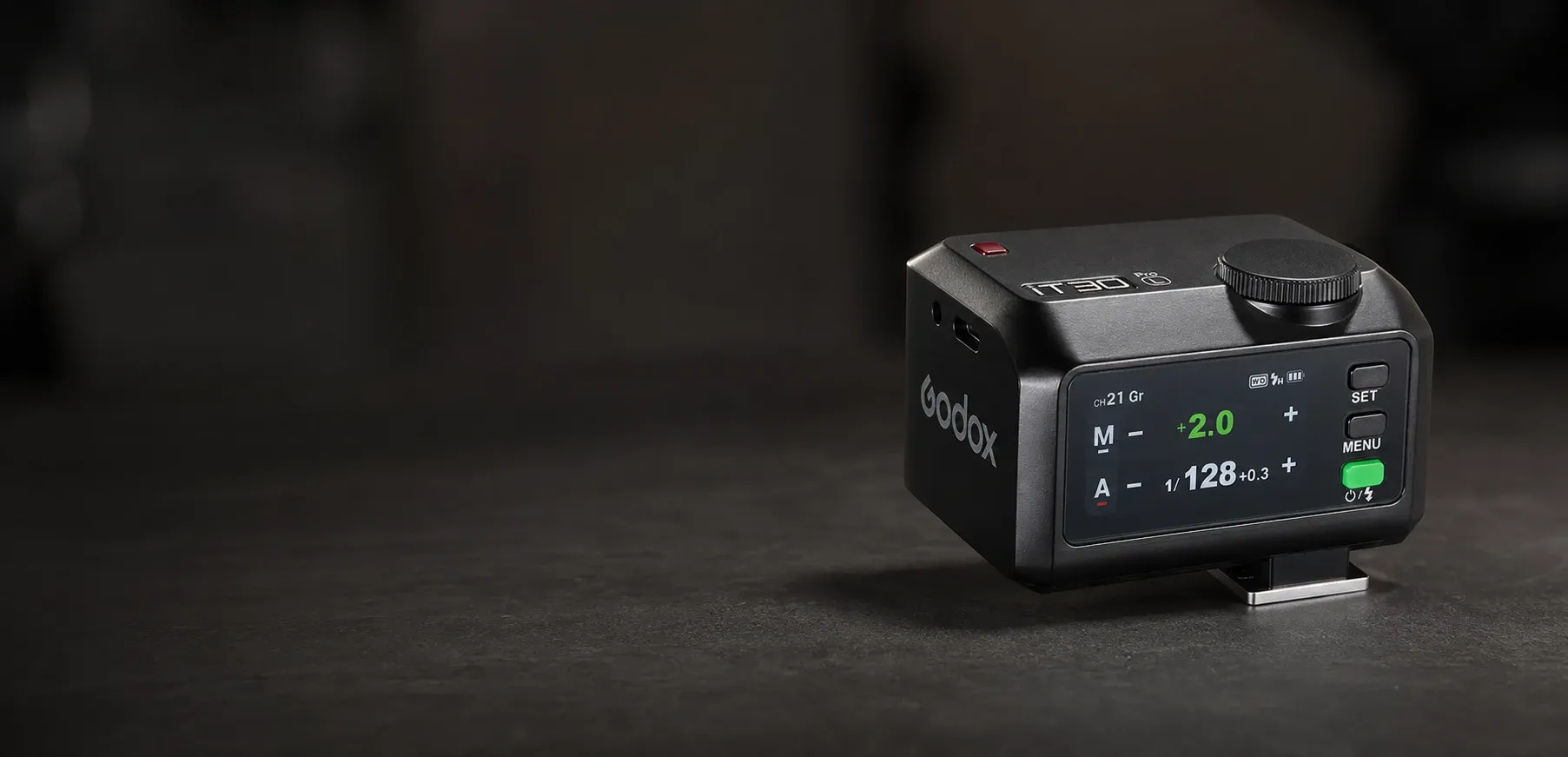 A premium compact TTL flash designed for Leica cameras, featuring a sleek black and silver design, displayed on a dark surface with clean lighting.