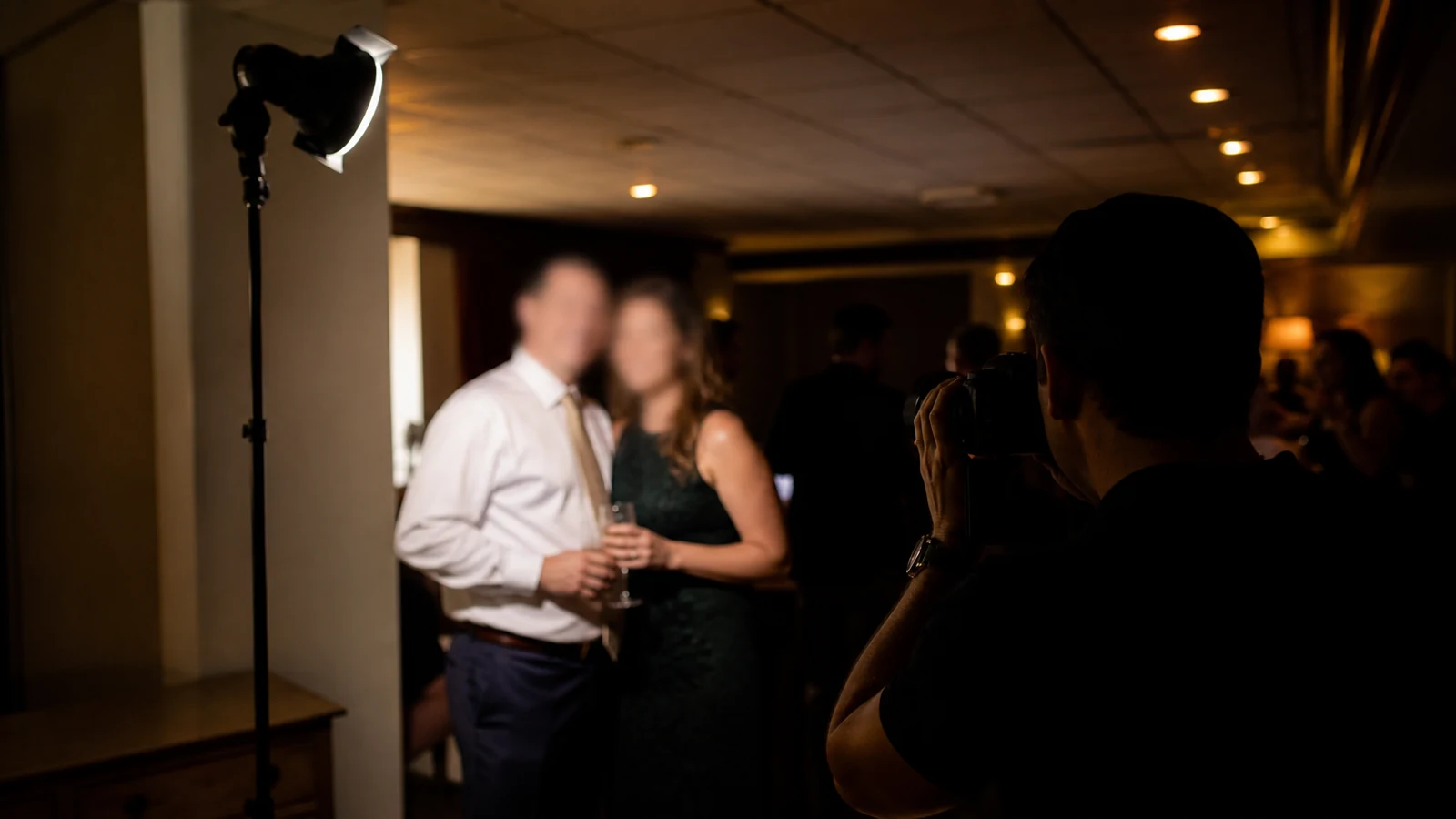 Off-camera TTL flash lighting a couple at a UK indoor event